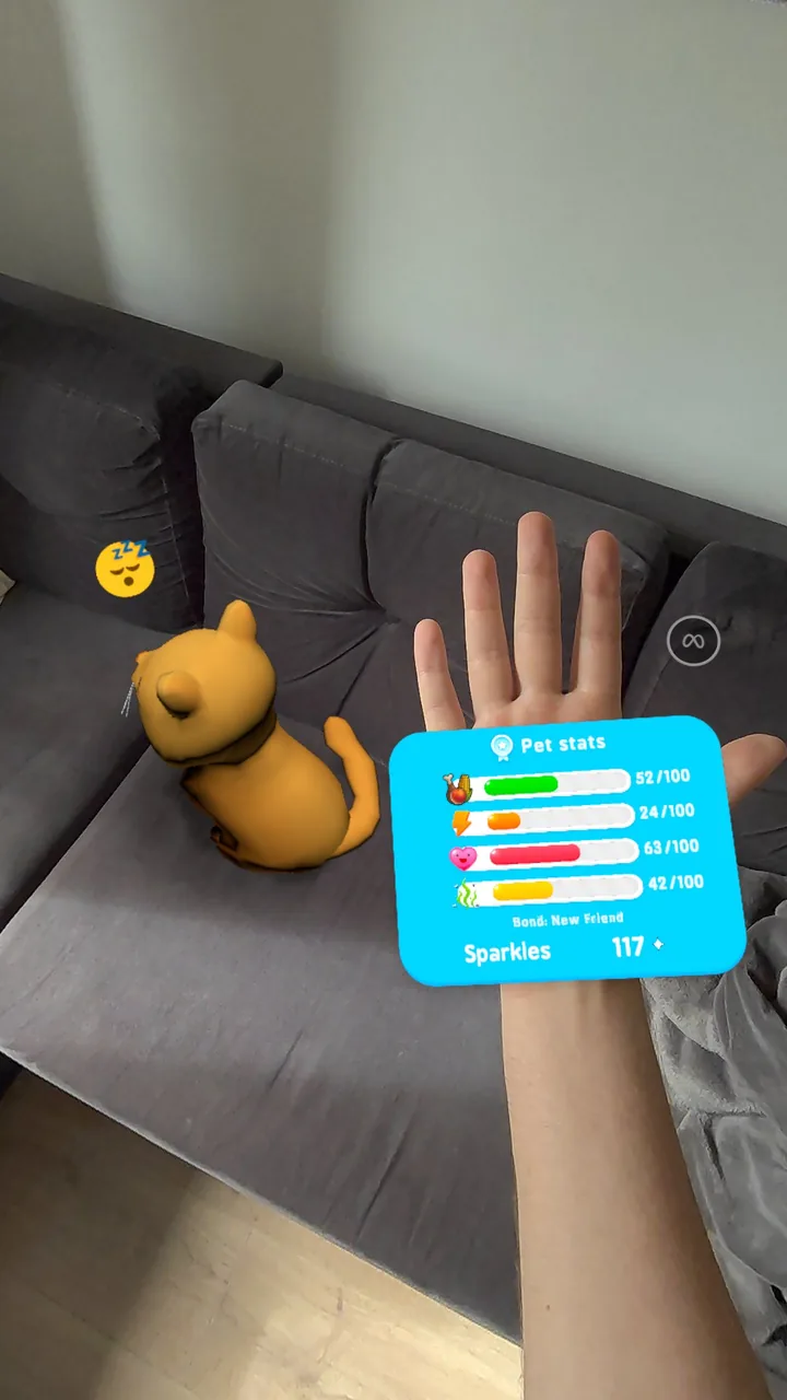Tobby resting on a real sofa while the player's wrist shows his stats and Bond stage
