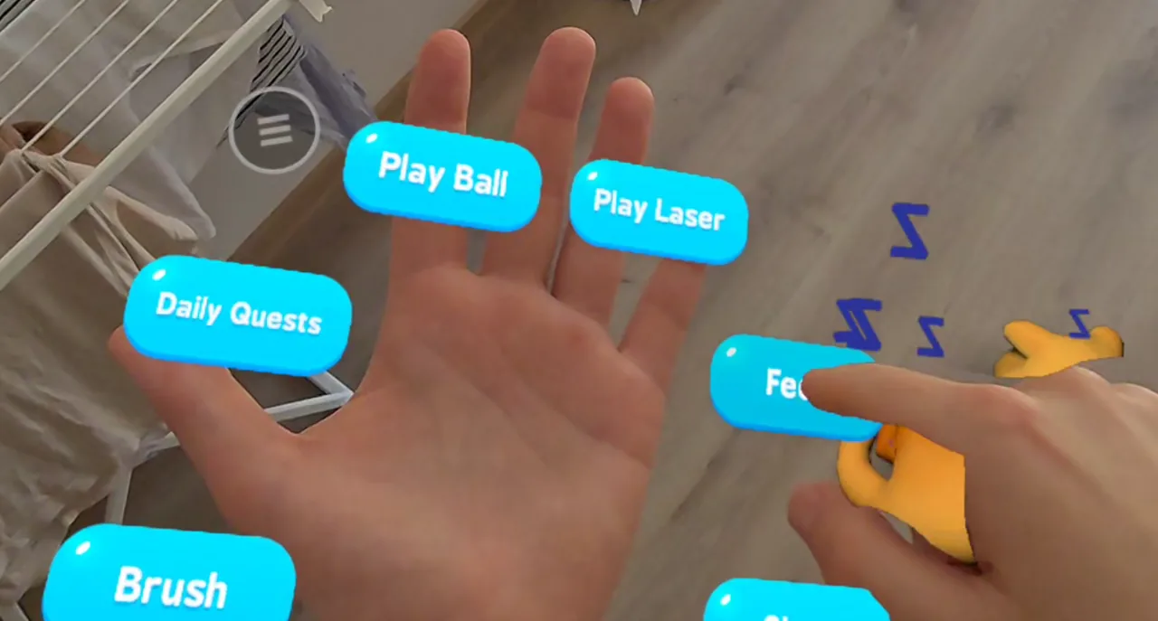 A bare hand pressing a floating Feed button on the palm menu while a cat waits nearby